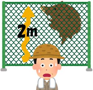 柵を上るイノシシ